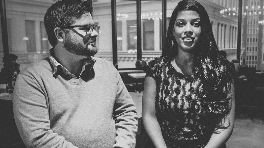 A man and a women from Bond Collective giving an interview